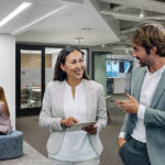 Co-workers chatting in the lobby